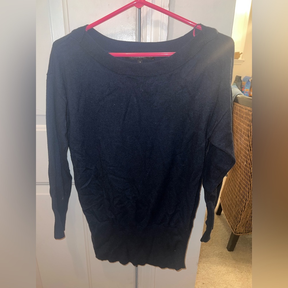 Woman’s small blue sweater